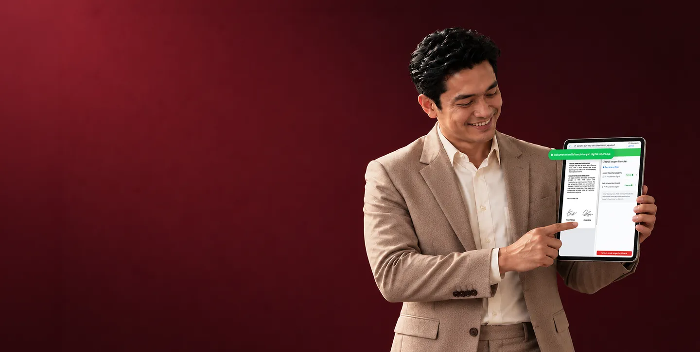 A man in a suit showing a document with two verified digital signatures on his tablet